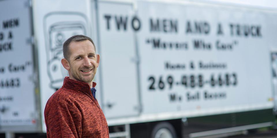 Man in front of truck