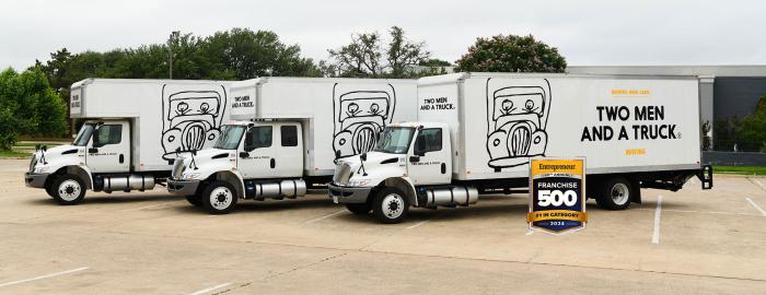 TWO MEN AND A TRUCK moving trucks in a row