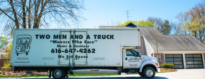 moving truck parked in front of a house